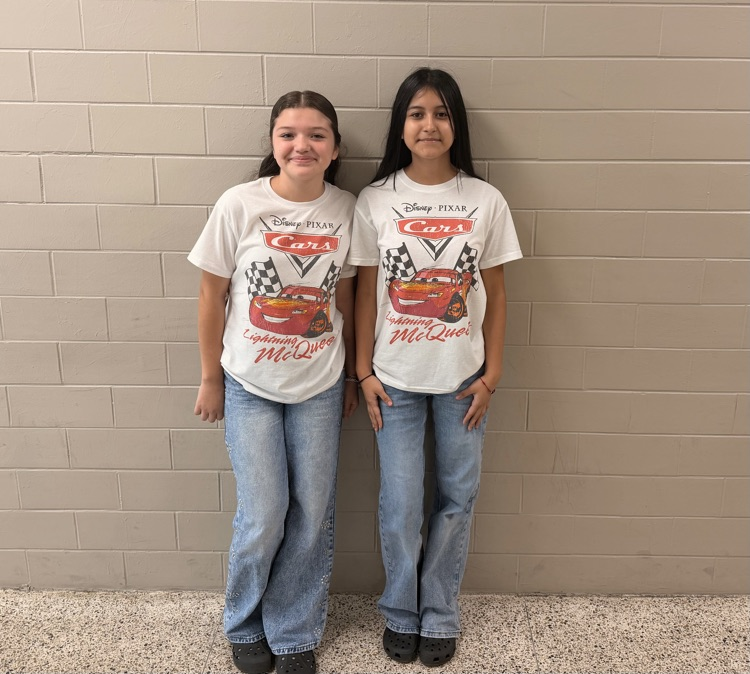 Two HMS students wear matching Lightning McQueen shirts for Two to Tango Day.