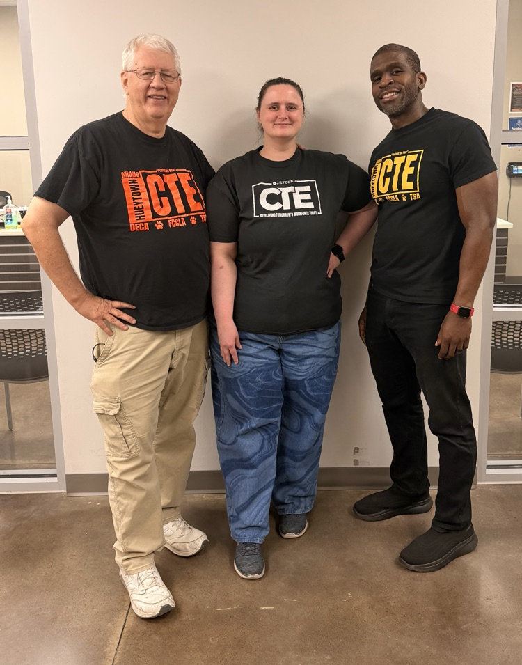 Three HMS CTE teachers pose together in coordinating CTE shirts during Homecoming Week.