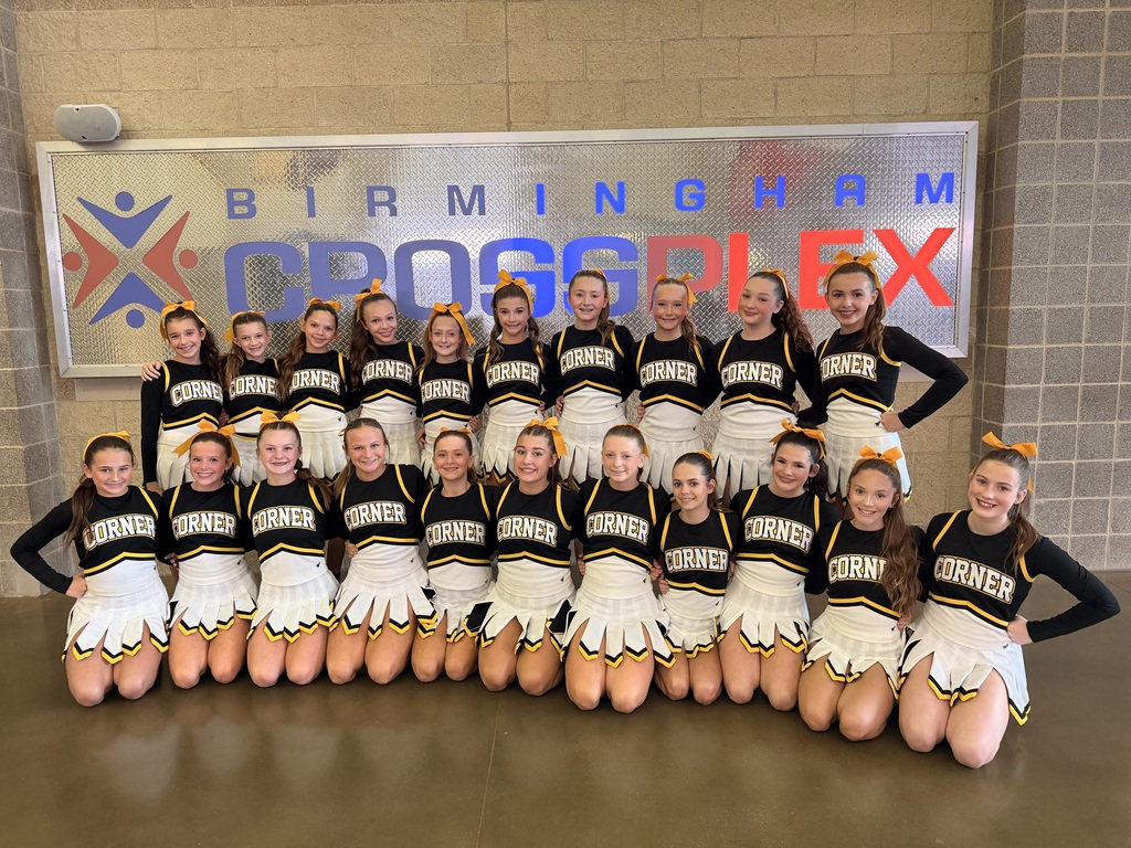 Cheerleaders in black white and gold uniforms