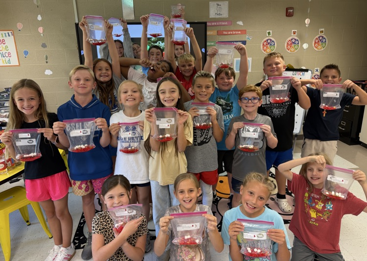 4th graders posing with the blood bags