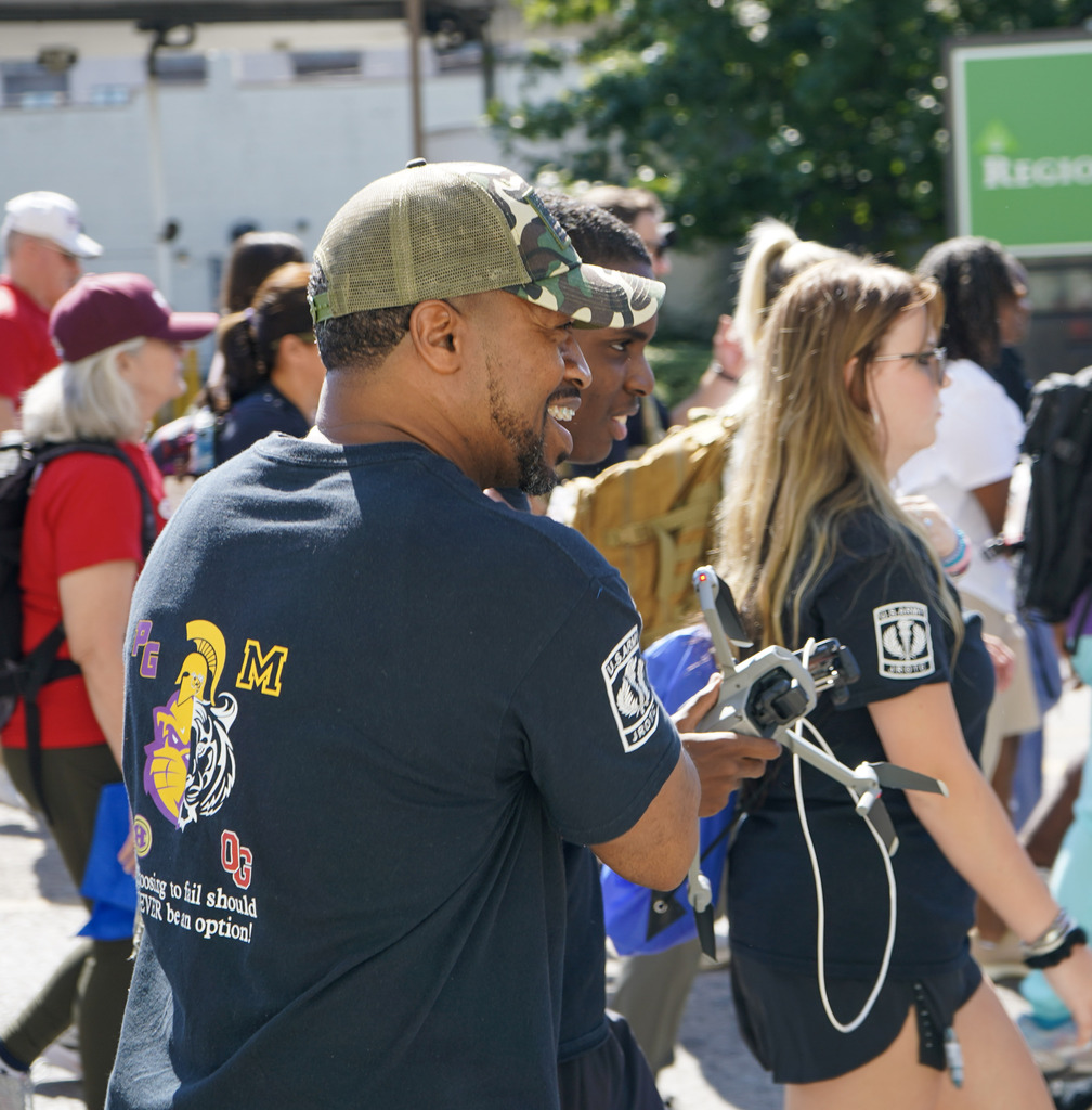 A man smiles while participating in a memorial ruck honoring veterans lost to suicide.