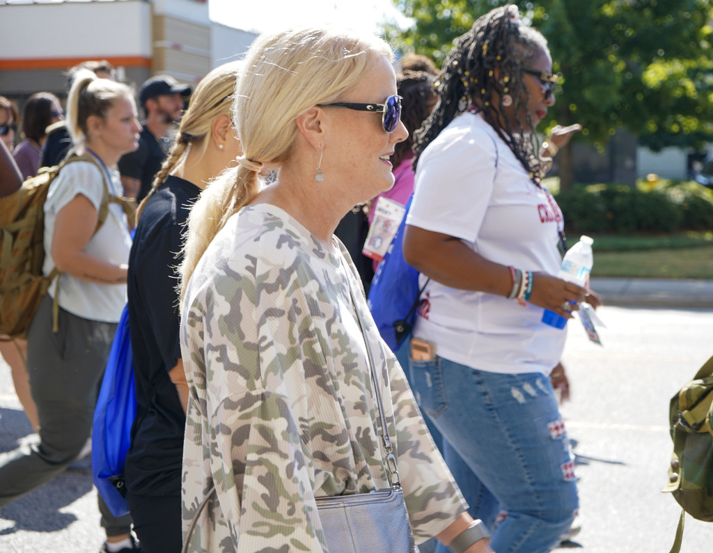 A woman participates in a walk to honor veterans lost to suicide.