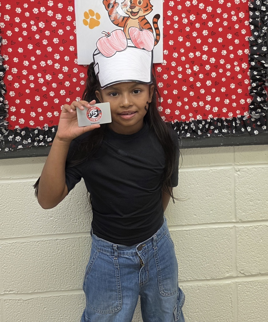girl holding a gift card
