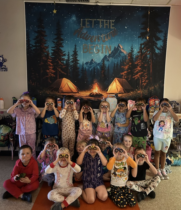 kindergarten students looking through binoculars