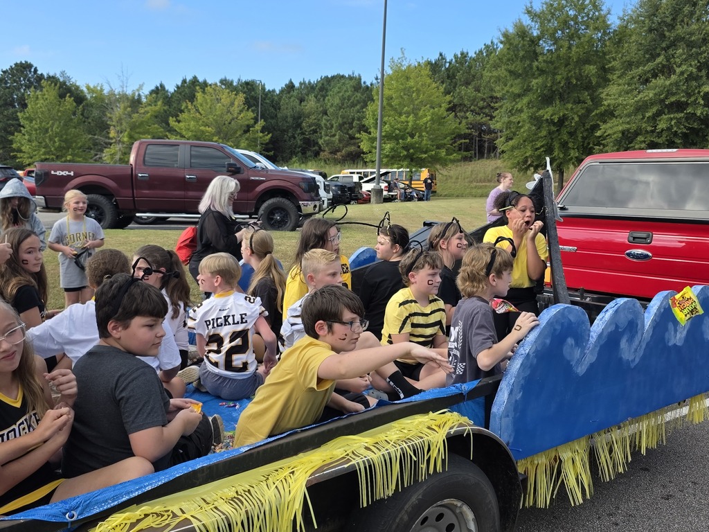 students riding on a parade float