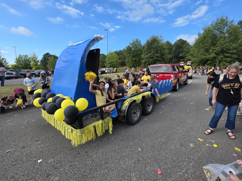 students riding on a parade float