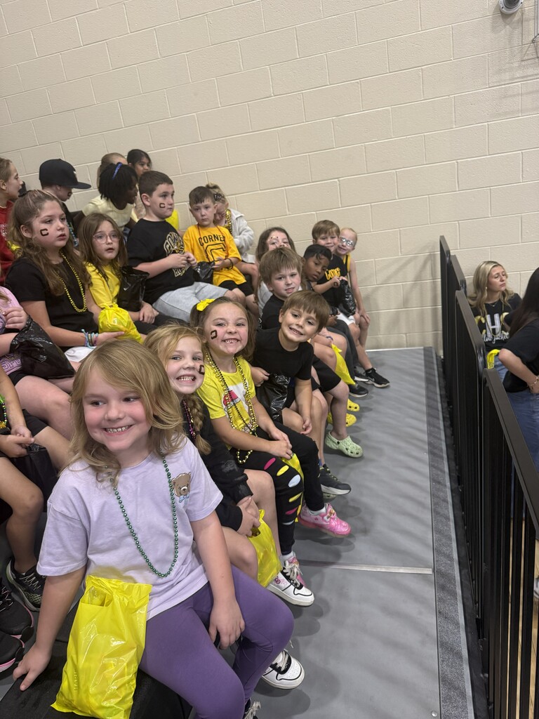 group of students sitting in the bleachers