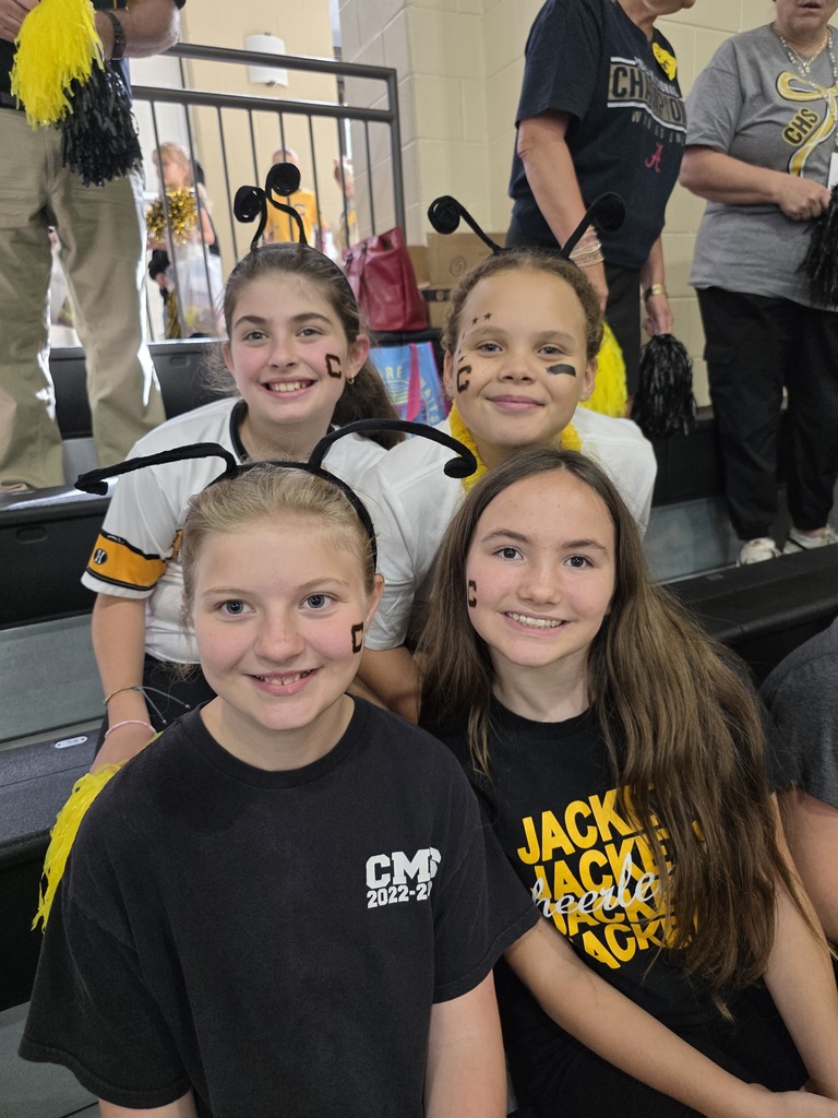 group of students sitting in the bleachers