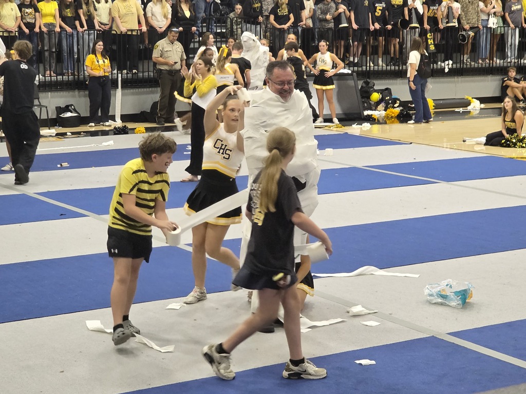 students rolling teacher with toilet paper