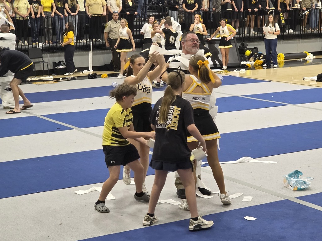 students rolling teacher with toilet paper