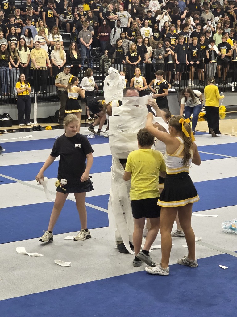students rolling teacher with toilet paper