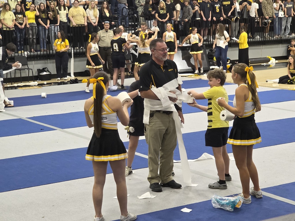 students rolling teacher with toilet paper