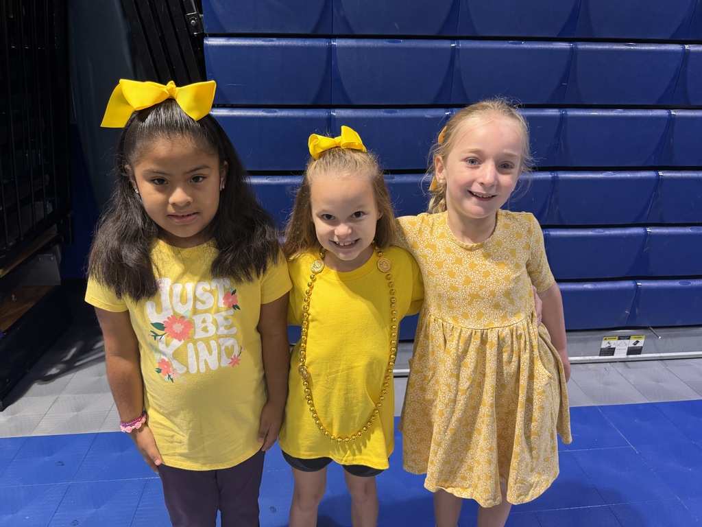 students dressed up in yellow for give hope day