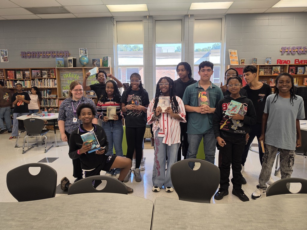 Students share books they selected for thier book reports.