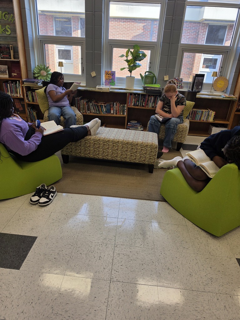 Students relax and read their favorite book in the library.