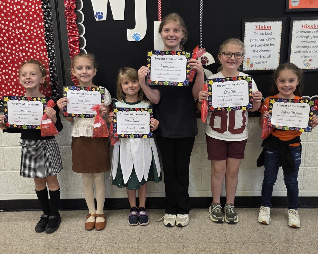 group of 6 students holding paper awards
