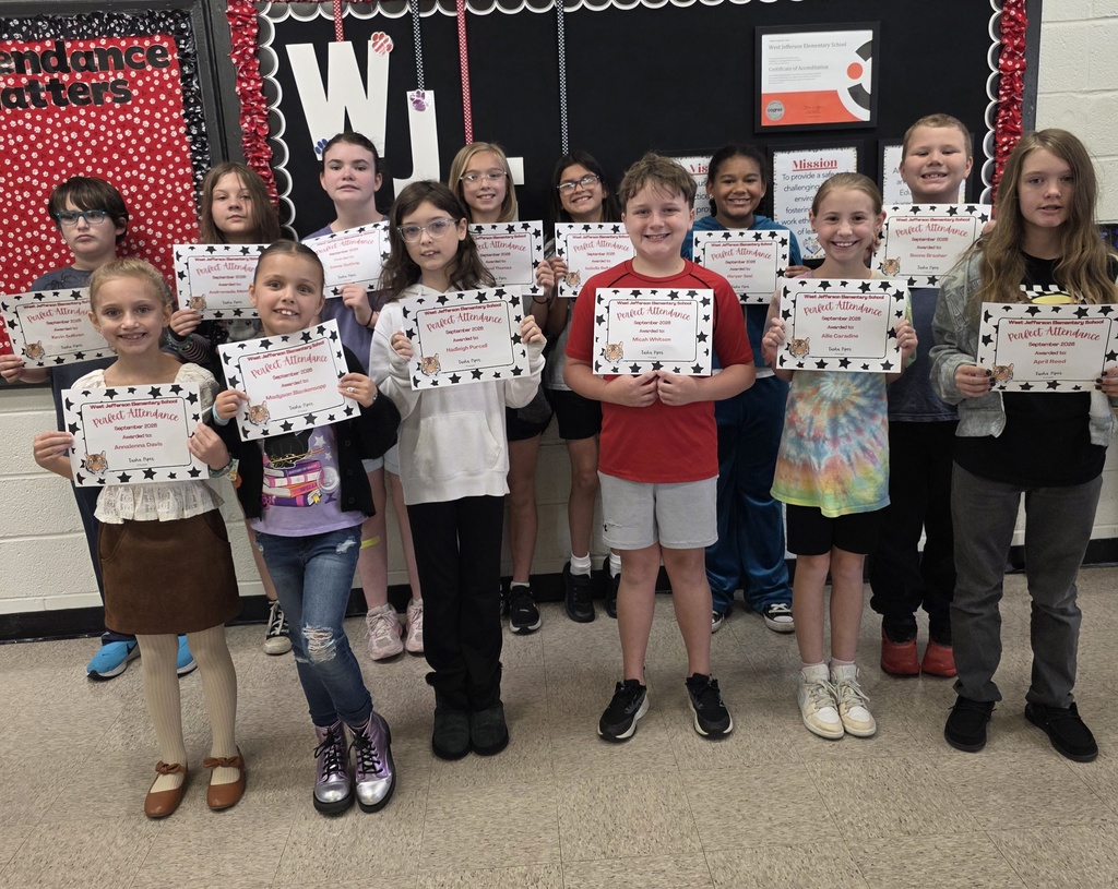 group of students holding paper awards