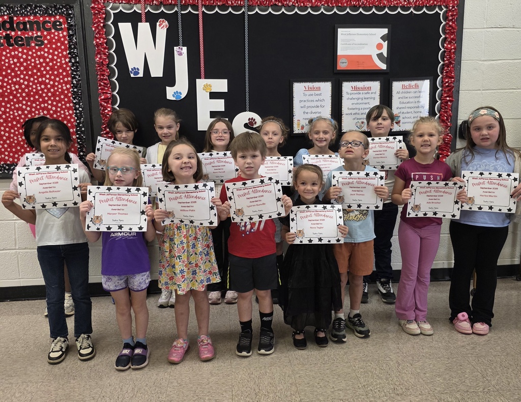 group of students holding paper awards