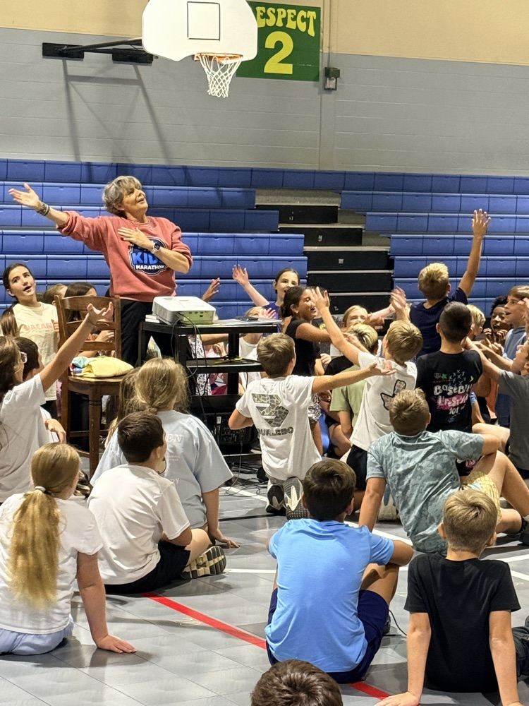 Coach Recke speaking to the kids