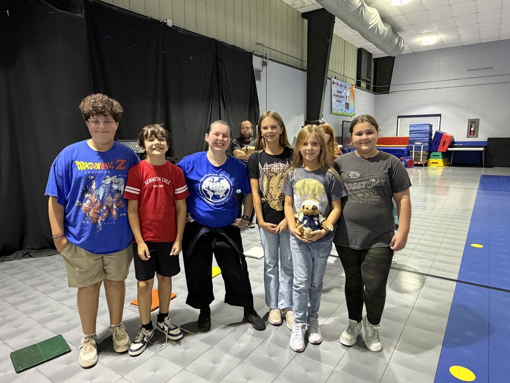 students with martial arts instructor