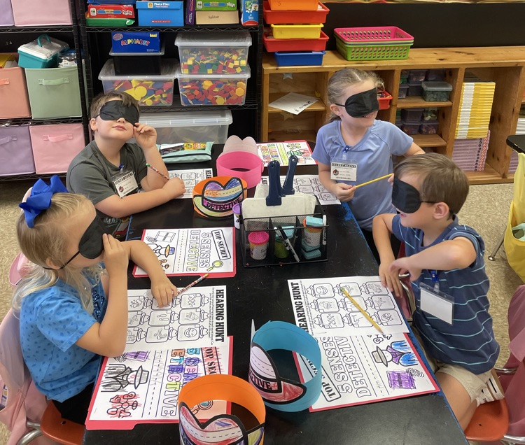 students using their sense of hearing