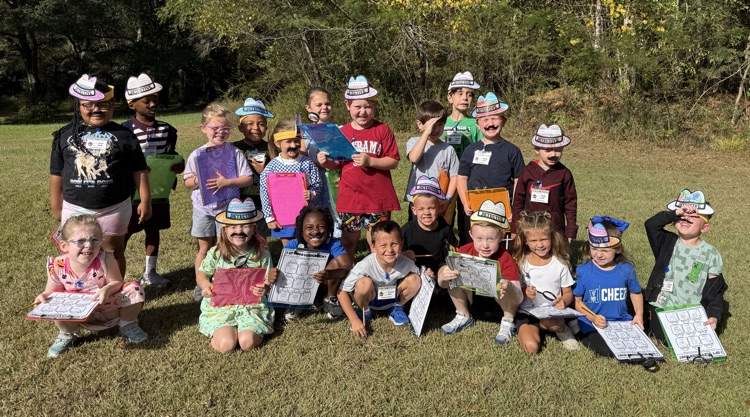 a kindergarten class of detectives outside