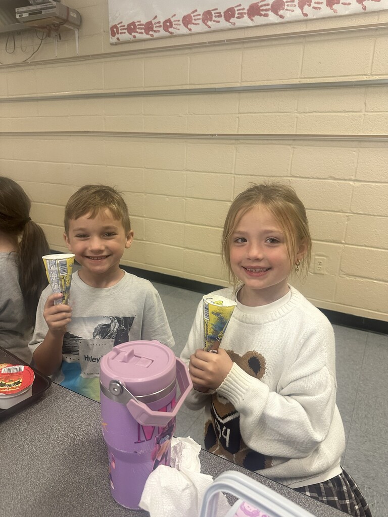 2 students holding ice cream