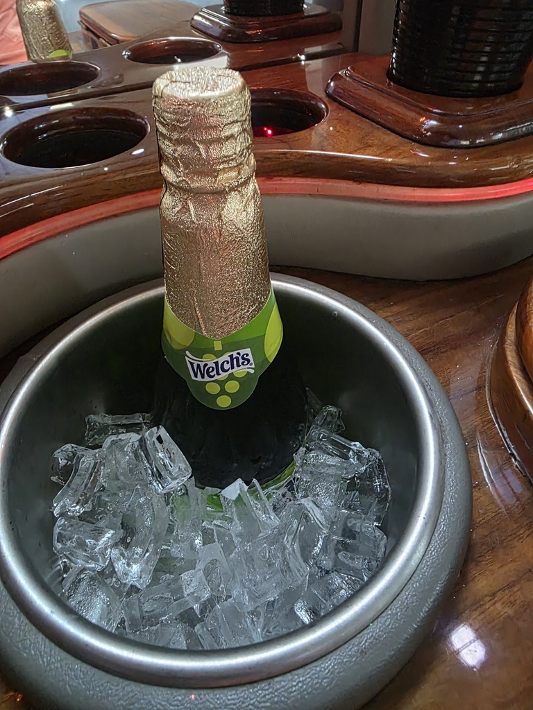 Welch's grape juice bottle in a bucket of ice