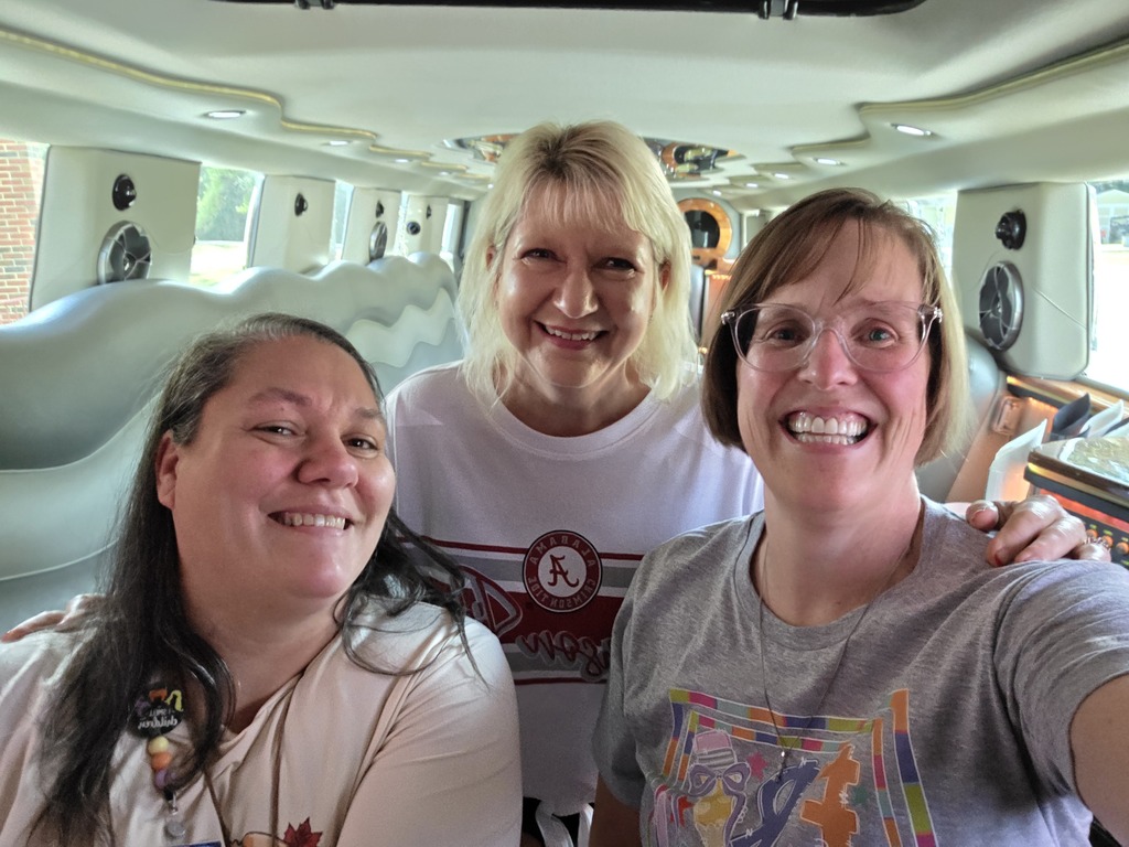 3 school staff members in the limo