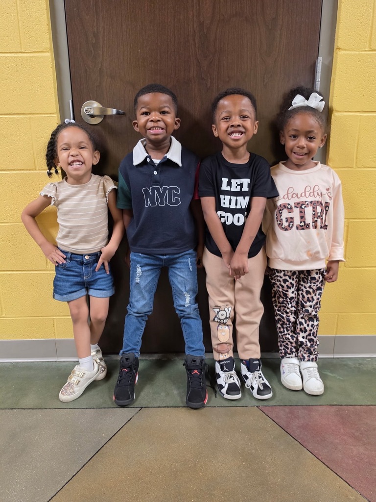 Group photo of the Pre-K Students of the Month smiling together and being recognized for their positive behavior, leadership, and hard work at school.