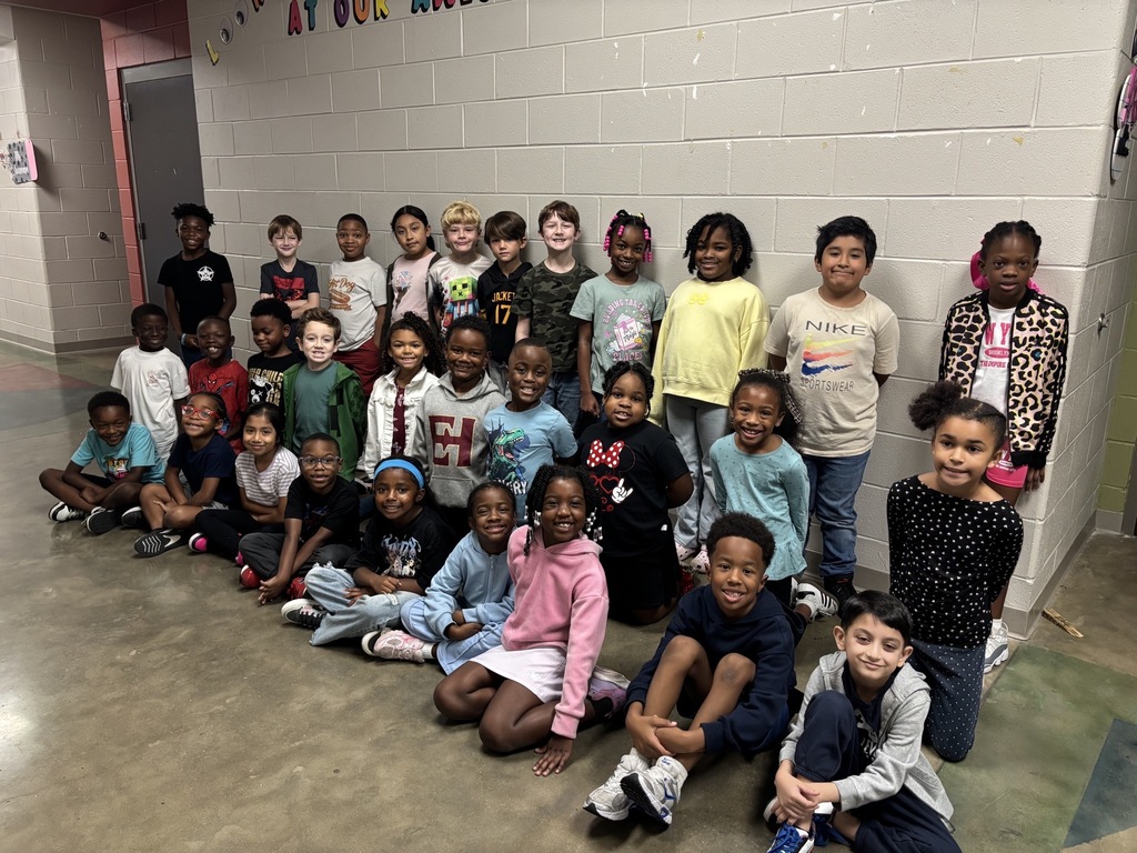 Group photo of the Second Grade Students of the Month smiling together and being recognized for their positive behavior, leadership, and hard work at school.