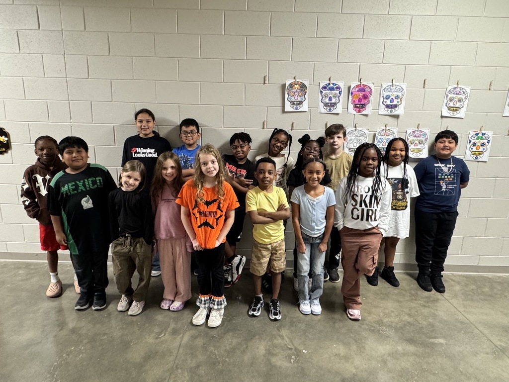 Group photo of the Third Grade Students of the Month smiling together and being recognized for their positive behavior, leadership, and hard work at school.