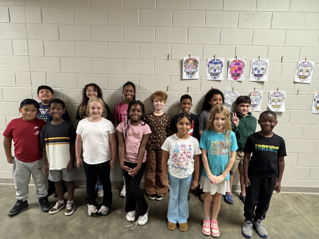 Group photo of the Third Grade Students of the Month smiling together and being recognized for their positive behavior, leadership, and hard work at school.