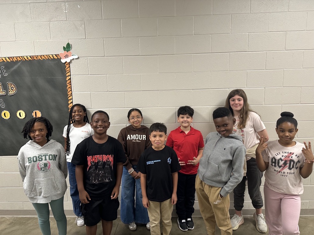 Group photo of the Fifth Grade Students of the Month smiling together and being recognized for their positive behavior, leadership, and hard work at school.