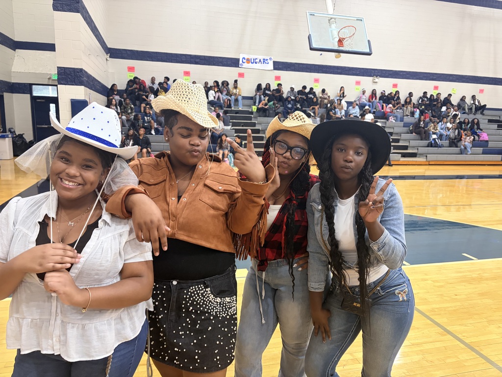 Four girls wearing cowgear