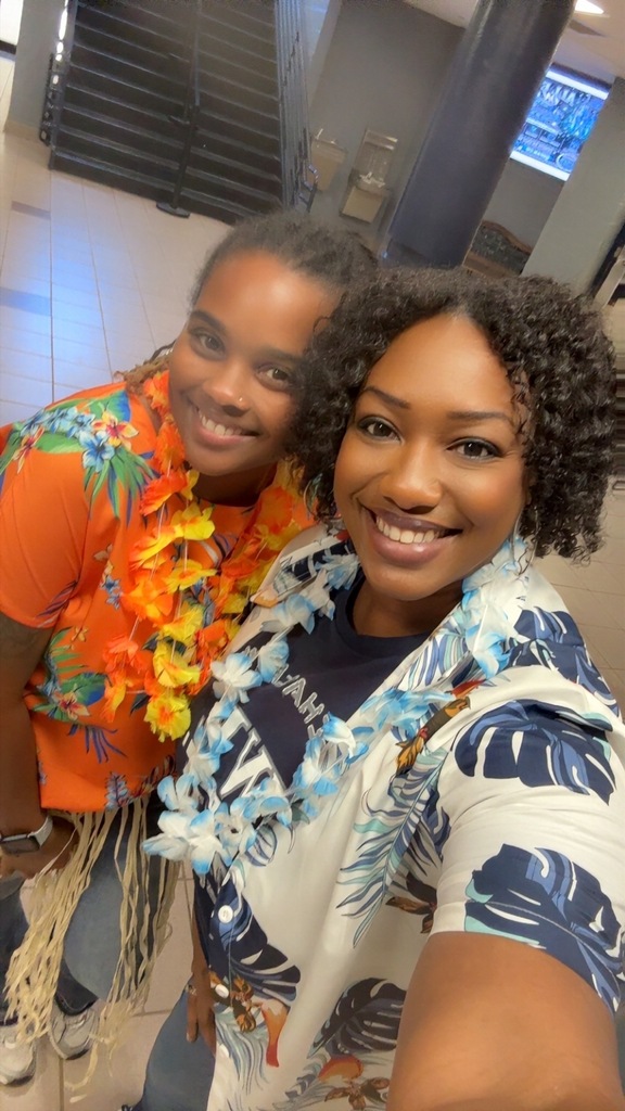 Two ladies wearing tropical 