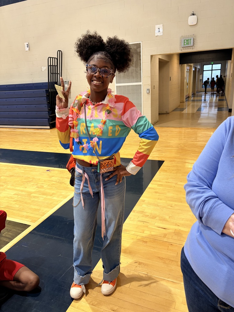 Girl wearing multiple bright colors and lei
