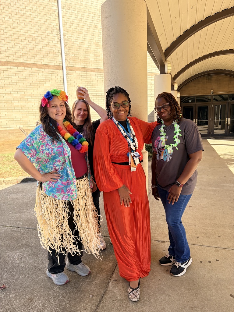 Teachers outside in tropical clothes