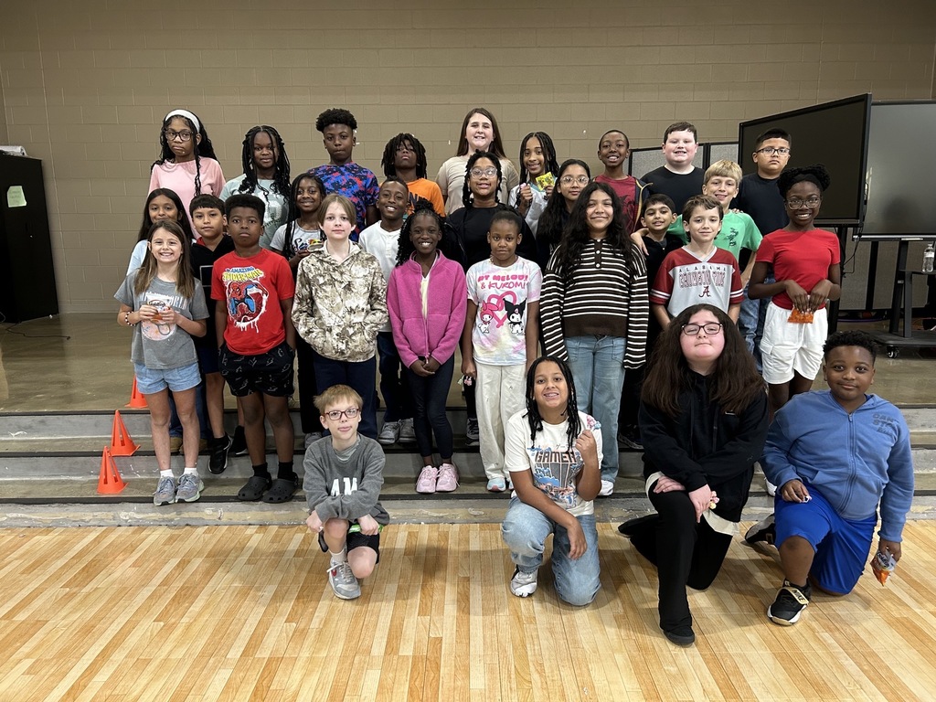 Group photo of McCalla Elementary fifth-grade students being celebrated for meeting their mCLASS and i-Ready benchmark goals.
