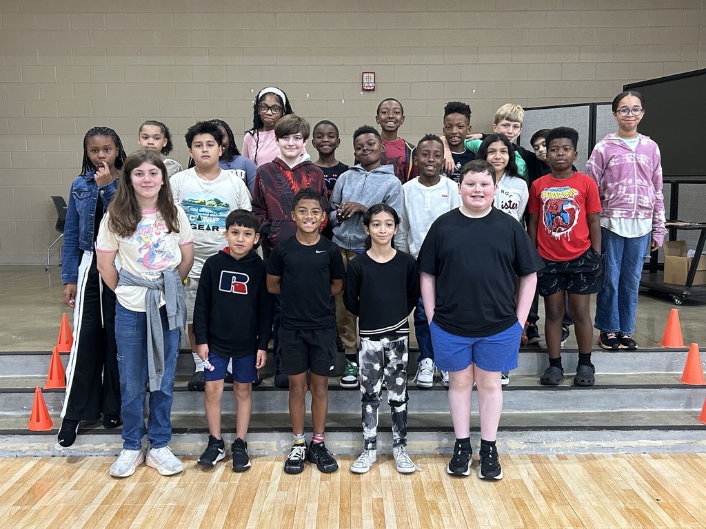 Group photo of McCalla Elementary fifth-grade students being celebrated for meeting their mCLASS and i-Ready benchmark goals.