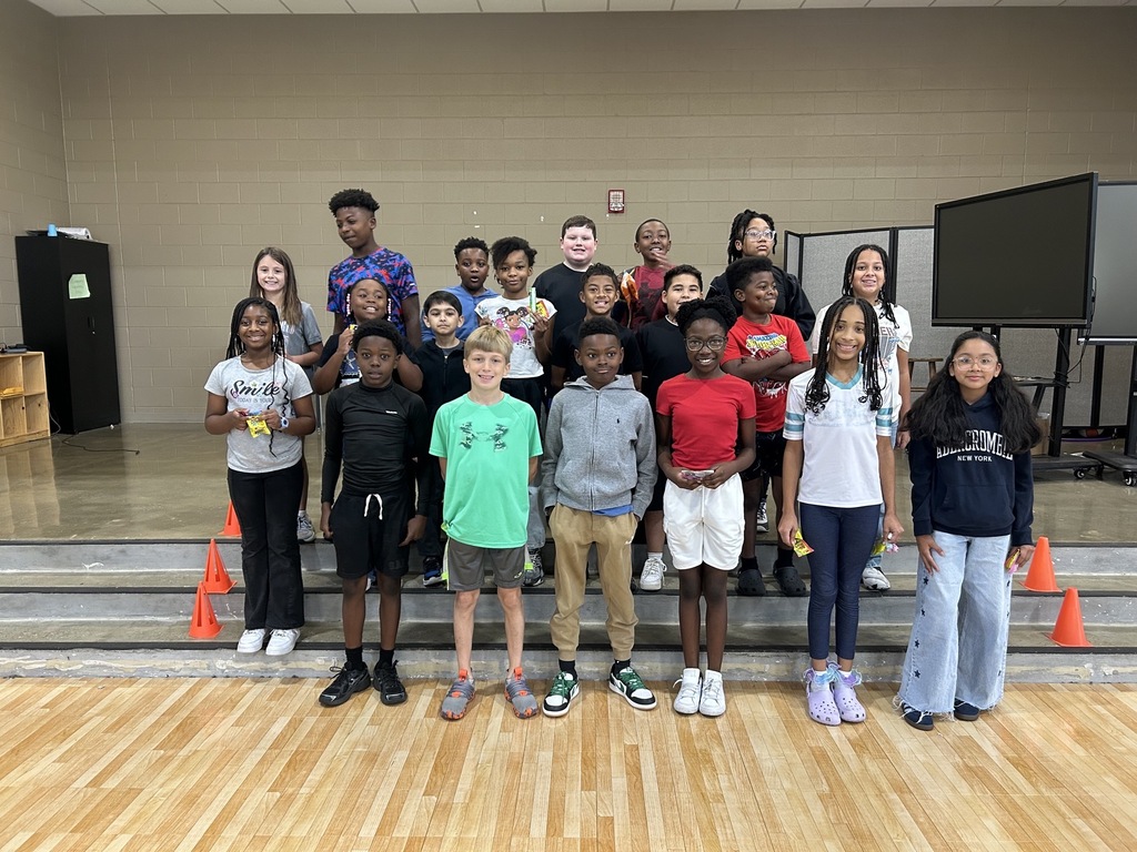 Group photo of McCalla Elementary fifth-grade students being celebrated for meeting their mCLASS and i-Ready benchmark goals.
