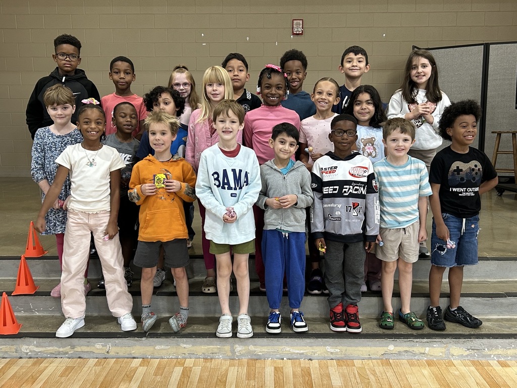 Group photo of McCalla Elementary second-grade students being recognized for meeting their mCLASS and i-Ready benchmark goals.