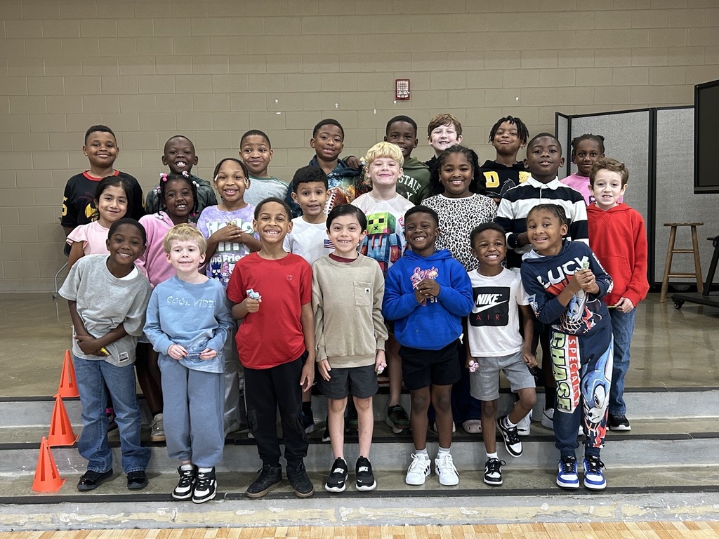 Group photo of McCalla Elementary second-grade students being recognized for meeting their mCLASS and i-Ready benchmark goals.