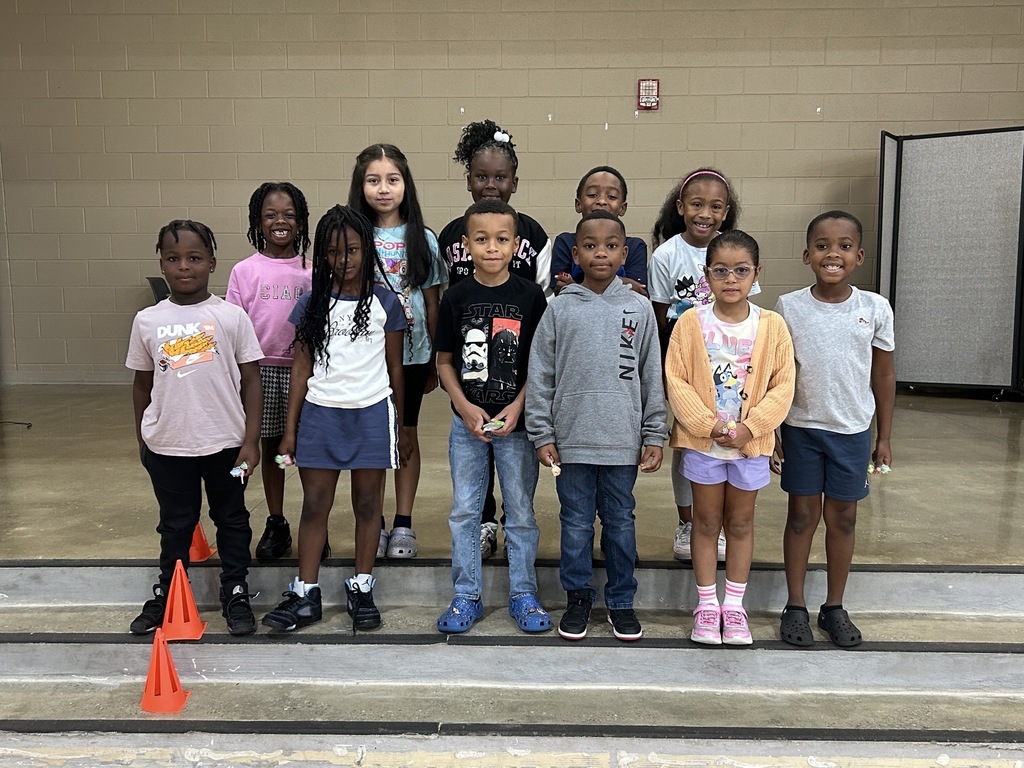 Group photo of McCalla Elementary second-grade students being recognized for meeting their mCLASS and i-Ready benchmark goals.