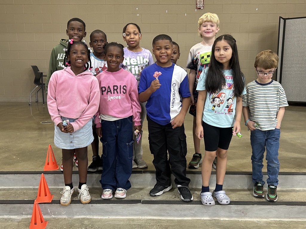 Group photo of McCalla Elementary second-grade students being recognized for meeting their mCLASS and i-Ready benchmark goals.
