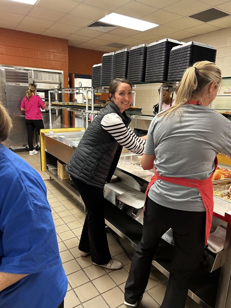 Mrs. Stewart helping on the lunch line