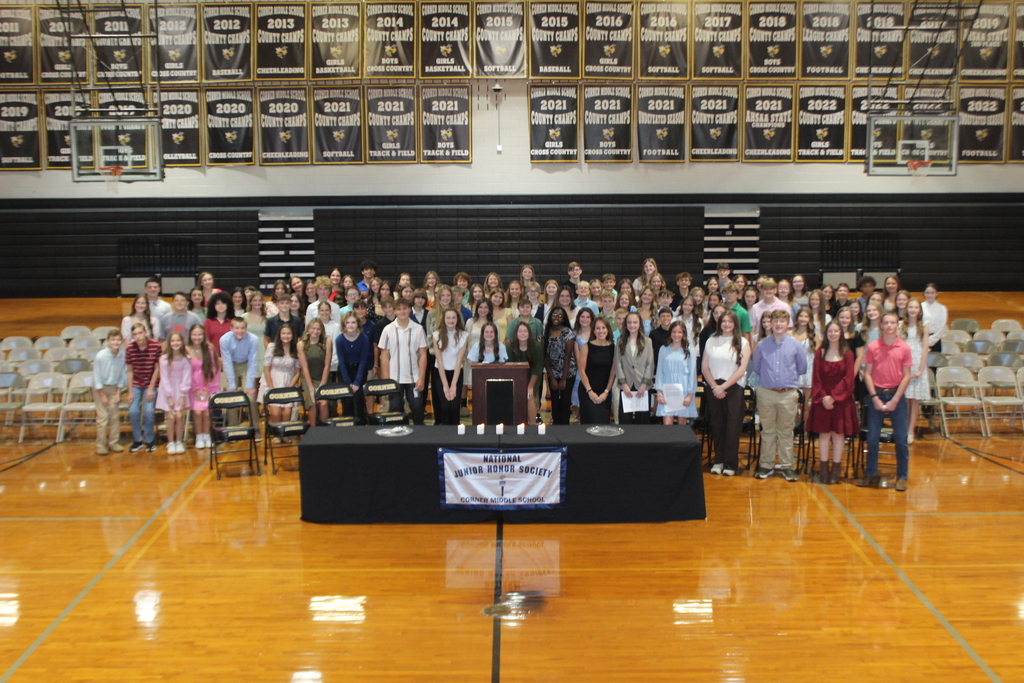 group of students standing in gym 