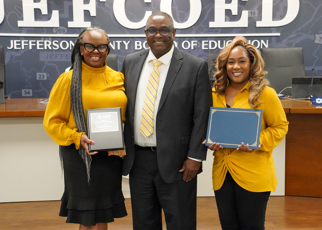 JEFCOED Superintendent Dr. Walter Gonsoulin poses for a photo with Board Vice President Ms. Stephanie Floyd and Board Member Ms. Carita Venable in the JEFCOED board room.
