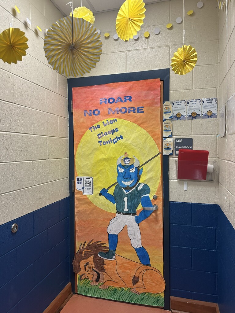 Mrs. Clayton's Advisory Door decorations. A Blue devil football player is standing on a lion. It says Roar no more, the lion sleeps tonight