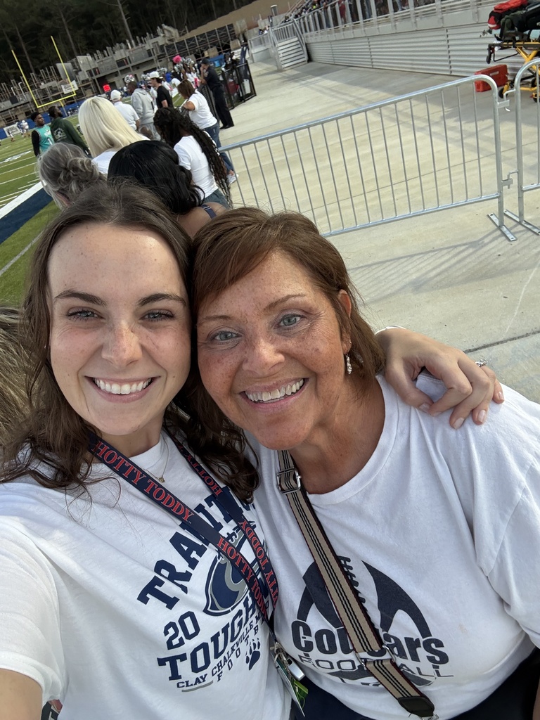 Two women in white shirts